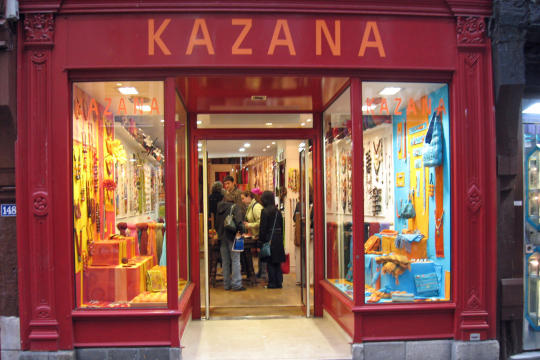 Shop on street with big clock in Rouen